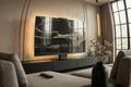 Halo Screen in Black Python stone with warm halo backlight on a matte-black base in a modern living room

